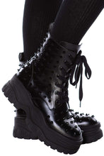 Load image into Gallery viewer, side of Black vegan leather platform boots with black studs all over. Lace-up front with side zipper. 100% polyurethane.