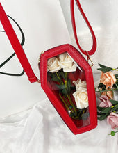 Load image into Gallery viewer, Red vegan leather coffin shaped bag with see through front. Inside of bag has black cross detail. Bag has full zip closure around entirety of coffin shape. Bag has adjustable shoulder strap.