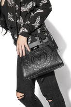 Load image into Gallery viewer, Embossed baphomet goat detail on front. Gunmetal hardware. Removable adjustable over the shoulder straps. Attached top handle for carrying.

