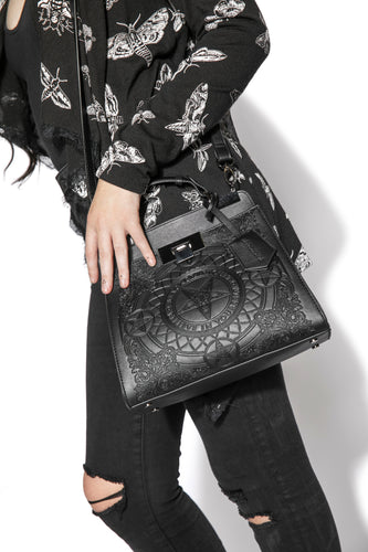 Embossed baphomet goat detail on front. Gunmetal hardware. Removable adjustable over the shoulder straps. Attached top handle for carrying.