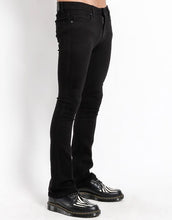 Load image into Gallery viewer, side view of Black cotton bootcut jeans. 
