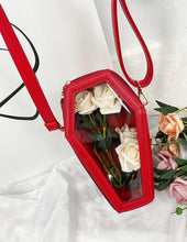 Load image into Gallery viewer, Red vegan leather coffin shaped bag with see through front. Inside of bag has black cross detail. Bag has full zip closure around entirety of coffin shape. Bag has adjustable shoulder strap.
